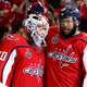Braden Holtby, No. 70, and Devante Smith-Pelly, No. 25, of the Washington Capitals celebrate their team’s 6-2 win over the Vegas Golden Knights in Game 4 of the 2018 NHL Stanley Cup Final at Capital One Arena on June 4, 2018, in Washington, D.C.